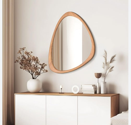 Modern living room mirror with an asymmetric wood frame by The Gharnish, designed for stylish home decor.