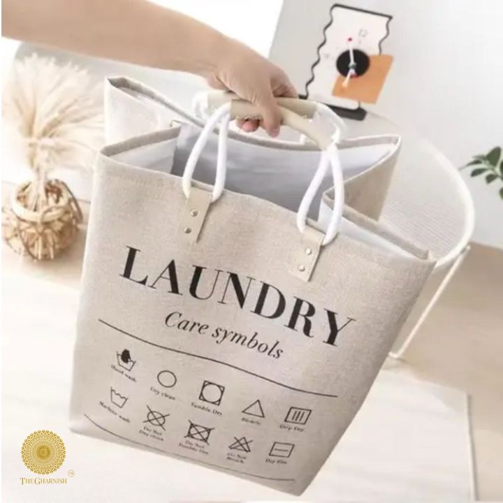 Black cotton folded laundry bags from The Gharnish, versatile storage bags for organizing clothes and laundry.