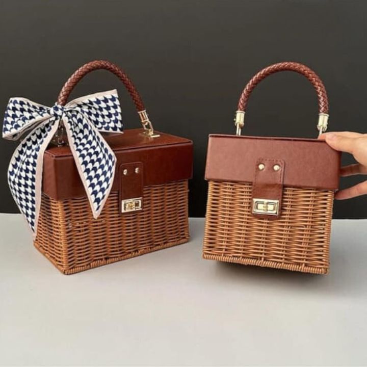 Small leather and rattan storage basket by The Gharnish, perfect for organizing souvenirs and household items.