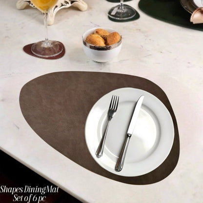 Modern leather heat-resistant and stylish table mats from The Gharnish, ideal for protecting surfaces and enhancing table decor.