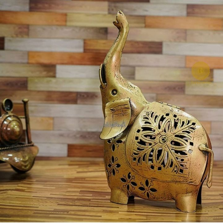 Gold painted T-light elephant table decor by The Gharnish, decorative tabletop piece with intricate elephant design.