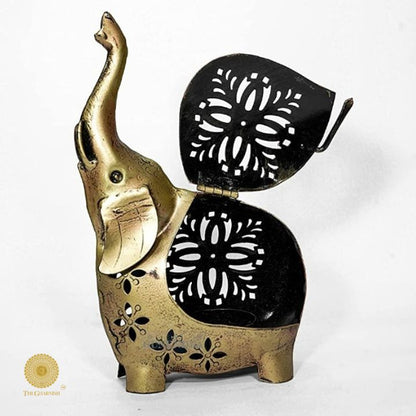 Gold painted T-light elephant table decor by The Gharnish, decorative tabletop piece featuring a detailed elephant design.