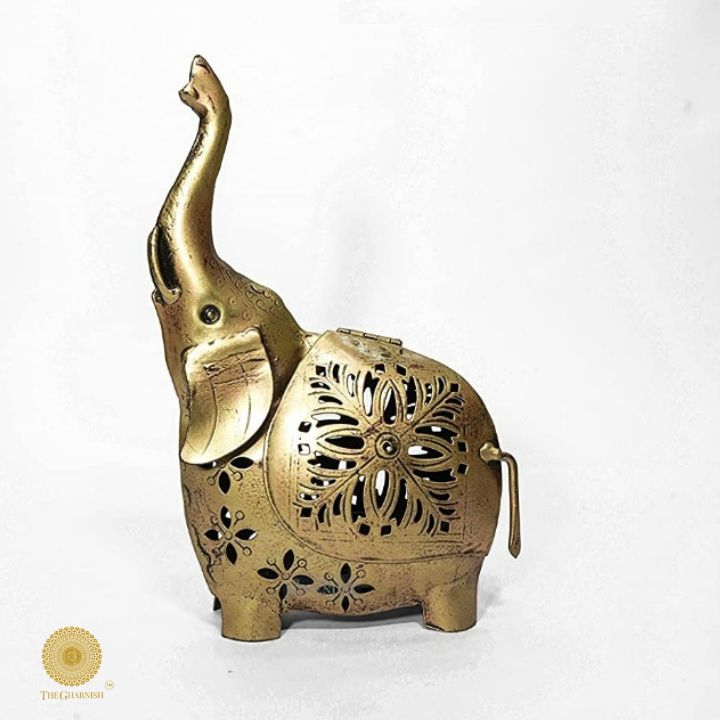 Gold painted T-light elephant table decor by The Gharnish, elegant tabletop accent with a decorative elephant design.
