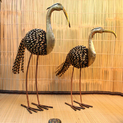 Pair of iron painted crane tea light holders from The Gharnish, decorative table top decor set of 2 with intricate crane figures.