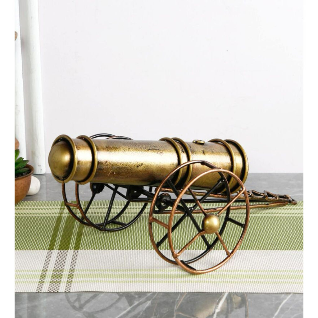 Metal cannon table decor by The Gharnish, a tabletop decorative piece with detailed armor and vintage design.