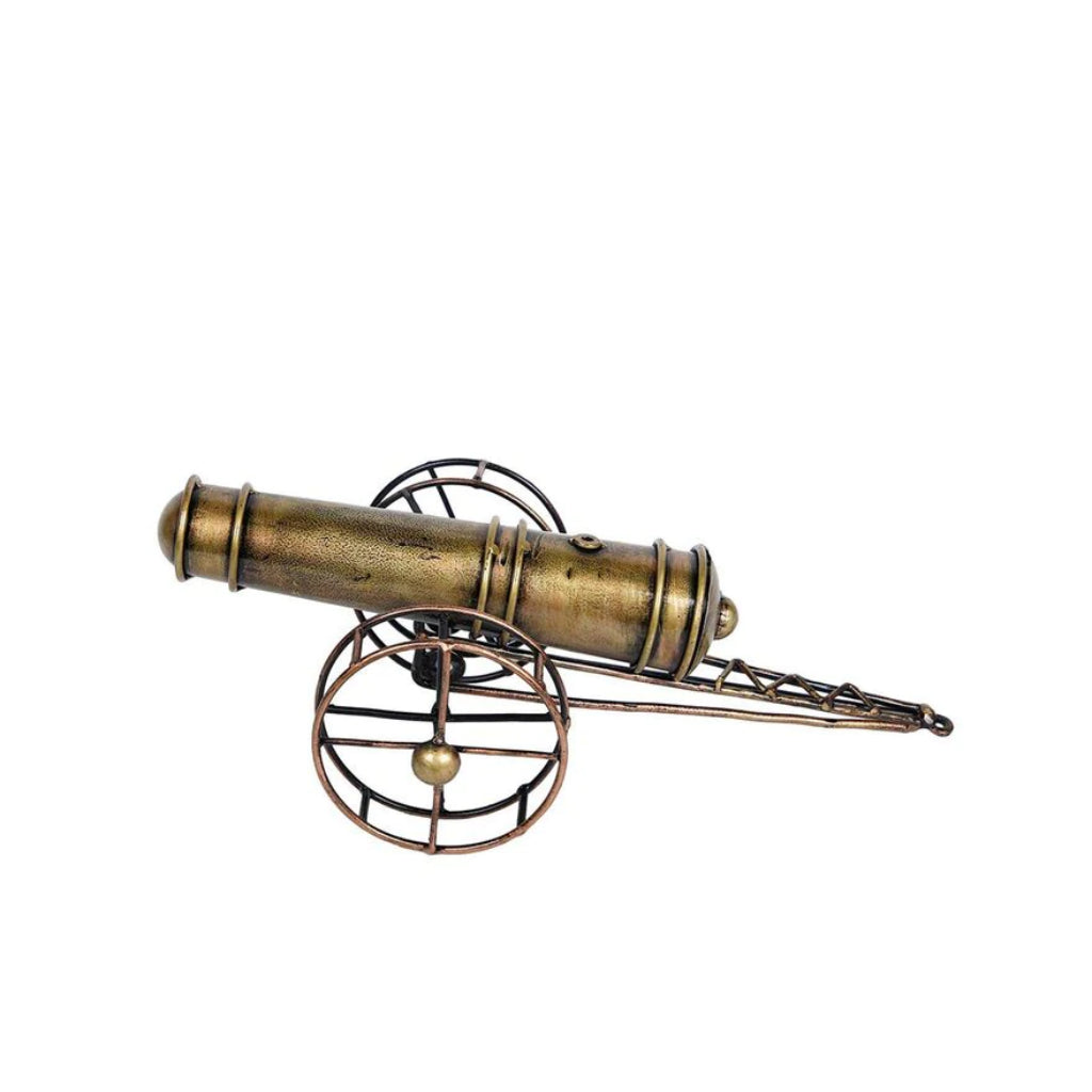 Metal cannon table decor by The Gharnish, a tabletop decorative piece with detailed metallic finish for nautical or vintage themes.