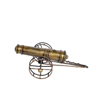 Metal cannon table decor by The Gharnish, a tabletop decorative piece with detailed metallic finish for nautical or vintage themes.
