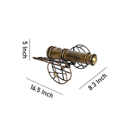 Metal cannon table decor by The Gharnish, a decorative tabletop piece featuring a detailed metal cannon design.
