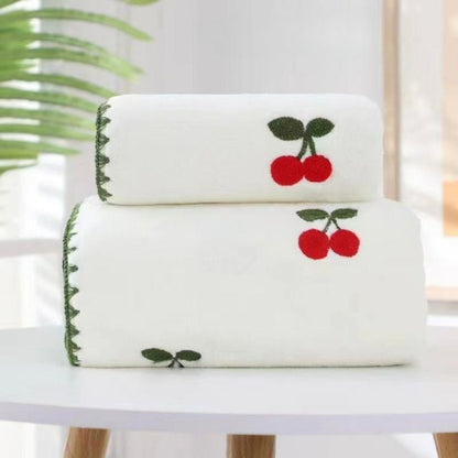 Embroidered full-size bath towel and hand towel combo by The Gharnish, soft and absorbent with decorative embroidery.