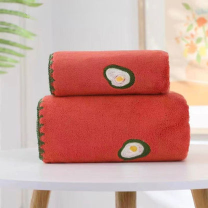 Embroidered full-size bath towel and matching hand towel set by The Gharnish, soft and absorbent linen with decorative embroidery.