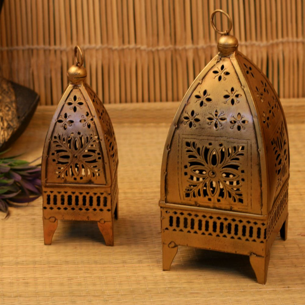 Set of two antique Minnar hanging lanterns by The Gharnish, traditional lights with intricate metalwork and glass panels.
