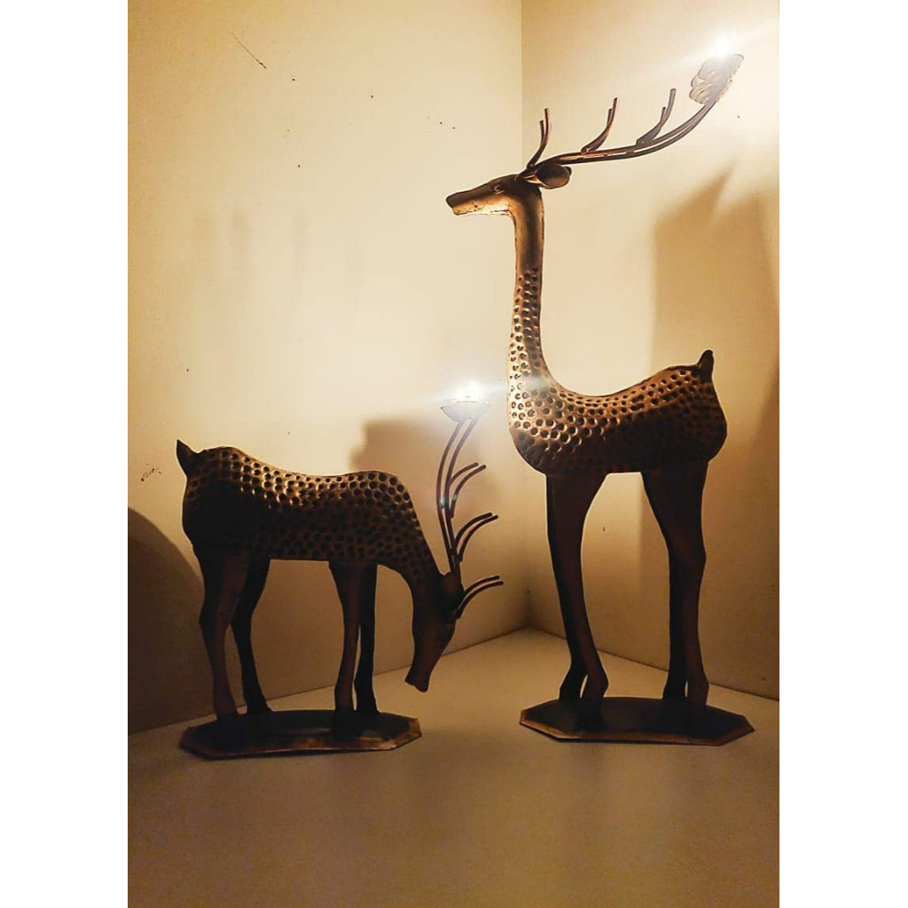 Antique deer family candle holder showpiece by The Gharnish, traditional lights decorative display with detailed animal figures.