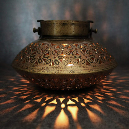 Gold iron Gihan T-Light holder decor by The Gharnish, featuring traditional design with intricate ironwork for elegant lighting.
