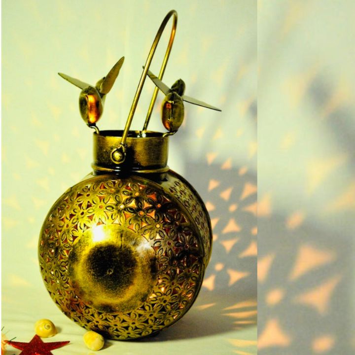 Hanging metal light with bird design from The Gharnish, traditional style decorative lighting fixture.
