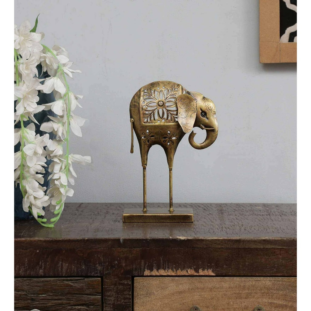 Metal T Light elephant figurine from The Gharnish, traditional decorative light accent with intricate design details.