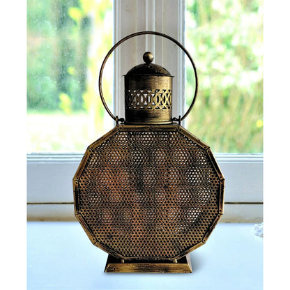 Set of 2 vintage lantern hanging T-light holders by The Gharnish, traditional lights with intricate metal designs for decorative use.