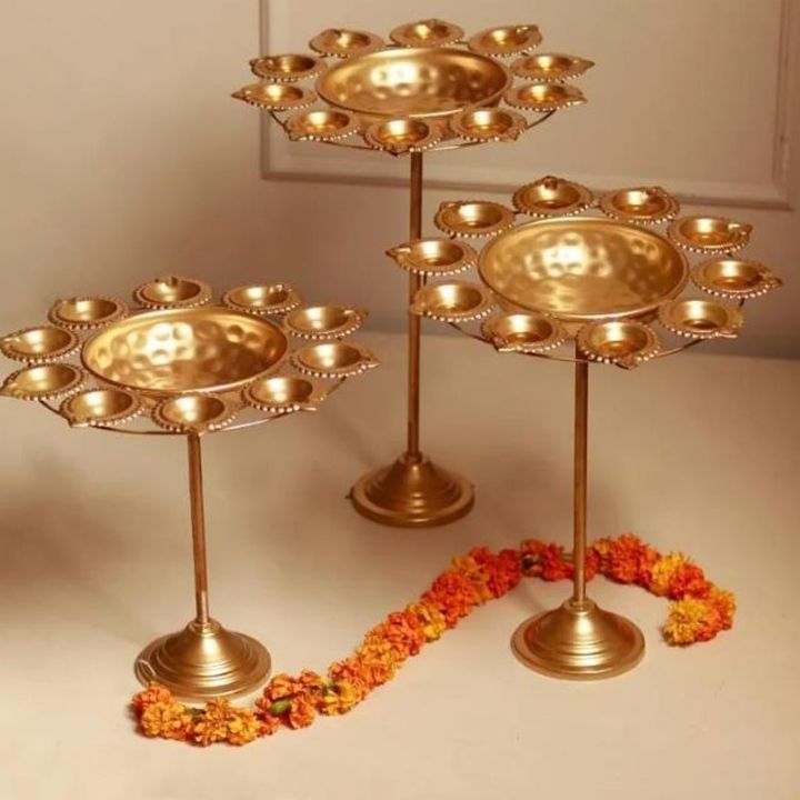 Deepak Urli with stand from The Gharnish, decorative brass bowl for oil or candles, set of three on a wooden stand.