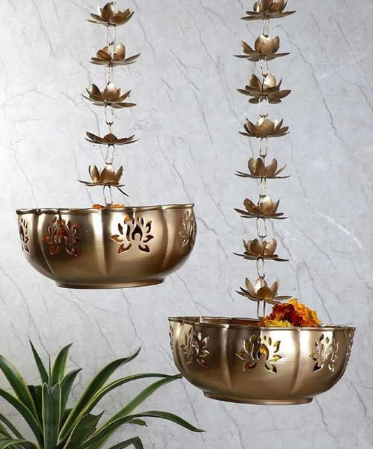 Set of two hanging Lotus Urli by The Gharnish, decorative ceramic bowls with lotus flower design for home decor.