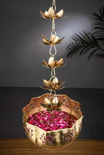 Set of two hanging Lotus Urli by The Gharnish, decorative brass bowls with intricate lotus design, ideal for home decor.