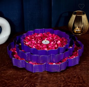 Set of three decorative metal Urli bowls in violet and gold by The Gharnish, featuring elegant, handcrafted design for home decor.