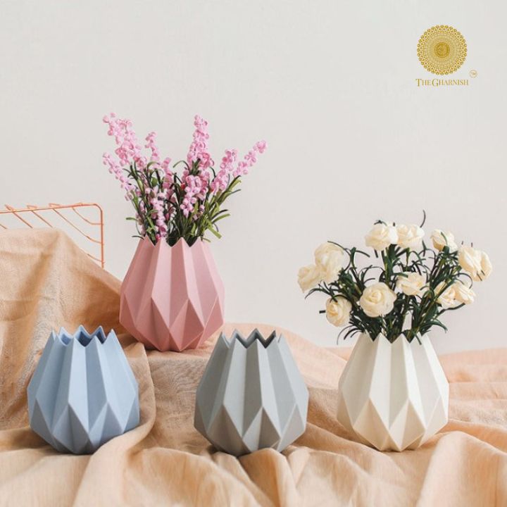Small black ceramic vase shaped like a lotus flower from The Gharnish, featuring intricate petal details and elegant design.