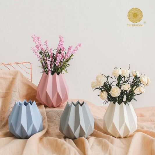 Small black ceramic vase shaped like a lotus flower from The Gharnish, featuring intricate petal details and elegant design.