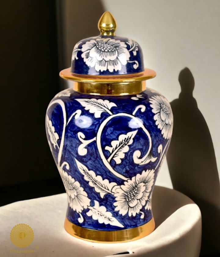 Decorative ceramic vase and ginger jar with intricate temple-themed designs by The Gharnish, perfect for tabletop decor.