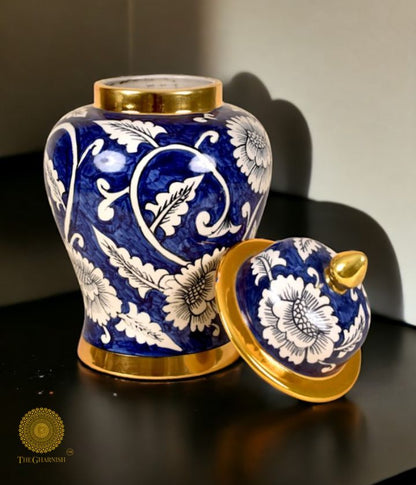 Decorative ceramic vase and ginger jar from The Gharnish, featuring intricate temple designs, for elegant table decor.