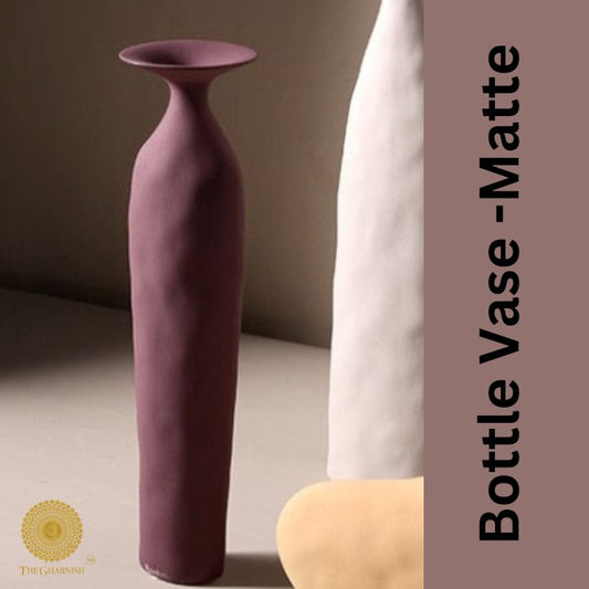 Ceramic rustic bottle vase by The Gharnish, 3.5x12 inches, with a textured finish and narrow neck, ideal for floral arrangements.