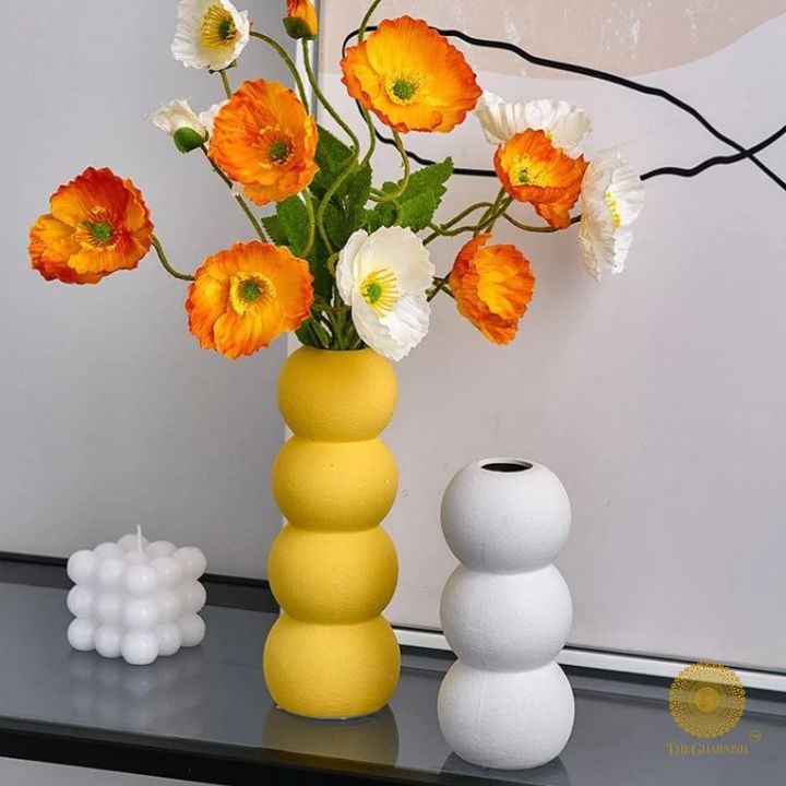 Elegant modern ceramic vase from The Gharnish with an artistic design, perfect for contemporary home decor.