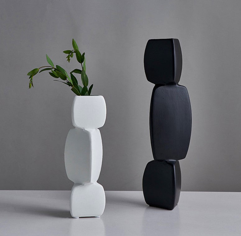 Set of two triangular square ceramic vases by The Gharnish, featuring modern geometric design and neutral finish.