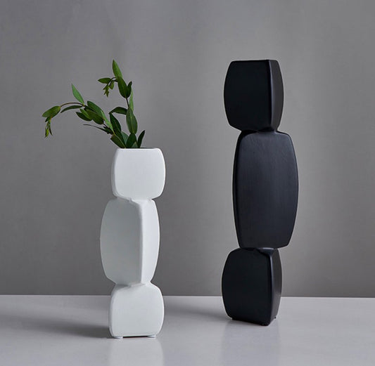 Set of two triangular square ceramic vases by The Gharnish, featuring modern geometric design and neutral finish.