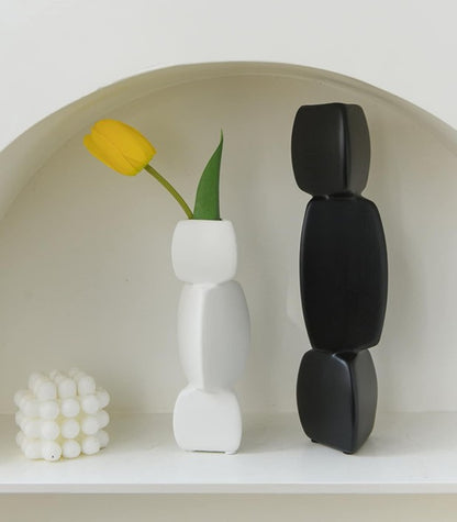 Set of two triangular and square ceramic vases by The Gharnish, featuring modern geometric design and matte finish.