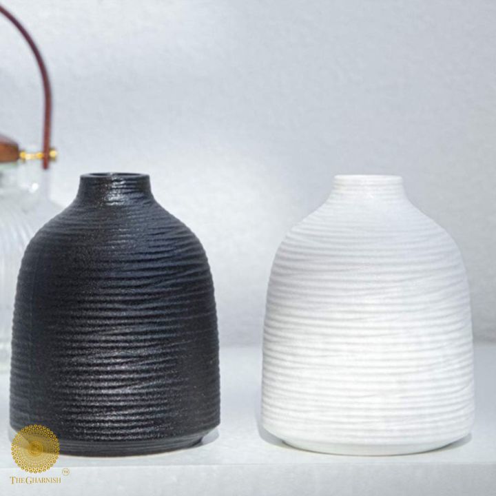 White premium matte ceramic vase by The Gharnish, showcasing a sleek, modern design suitable for home decor.