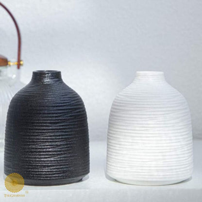 White premium matte ceramic vase by The Gharnish, showcasing a sleek, modern design suitable for home decor.