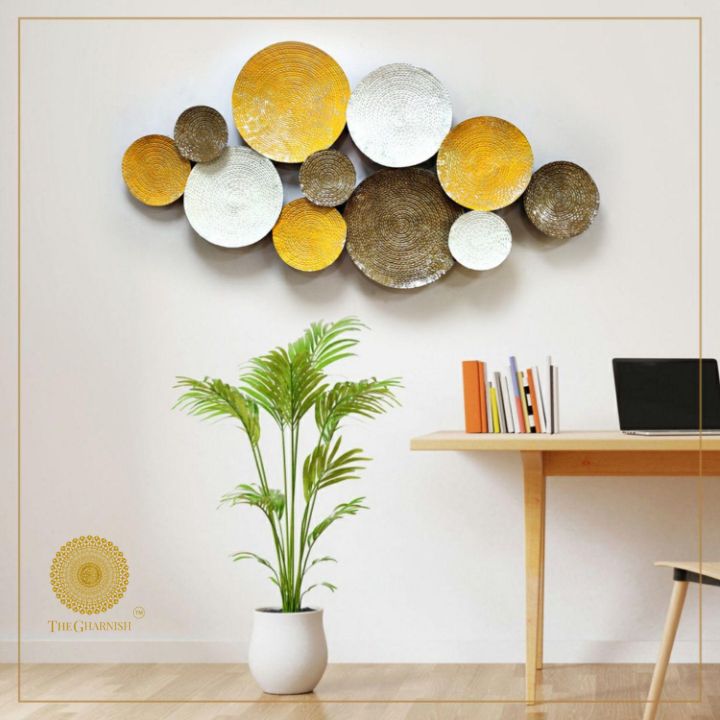 Metal wall art featuring 11 iron circles in a 48x24 inch design, modern decorative wall decor by The Gharnish.