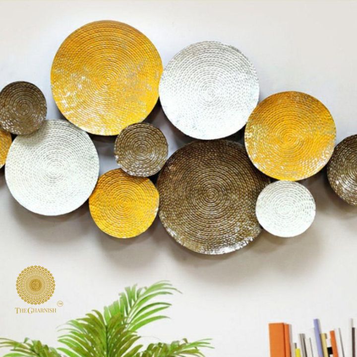 Metal wall art featuring 11 iron circles in a modern design, measuring 48x24 inches, by The Gharnish.