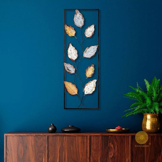 Metallic leaf wall art by The Gharnish, 12x36 inches, featuring modern leaf design in shiny metal finish for stylish wall decor.