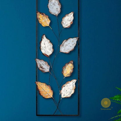 Metallic leaf wall art by The Gharnish, 12x36 inches, featuring shiny, textured leaf design for modern home decor.