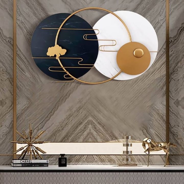 Metallic musical rings plates wall art by The Gharnish featuring circular, shiny metal art for wall decor.