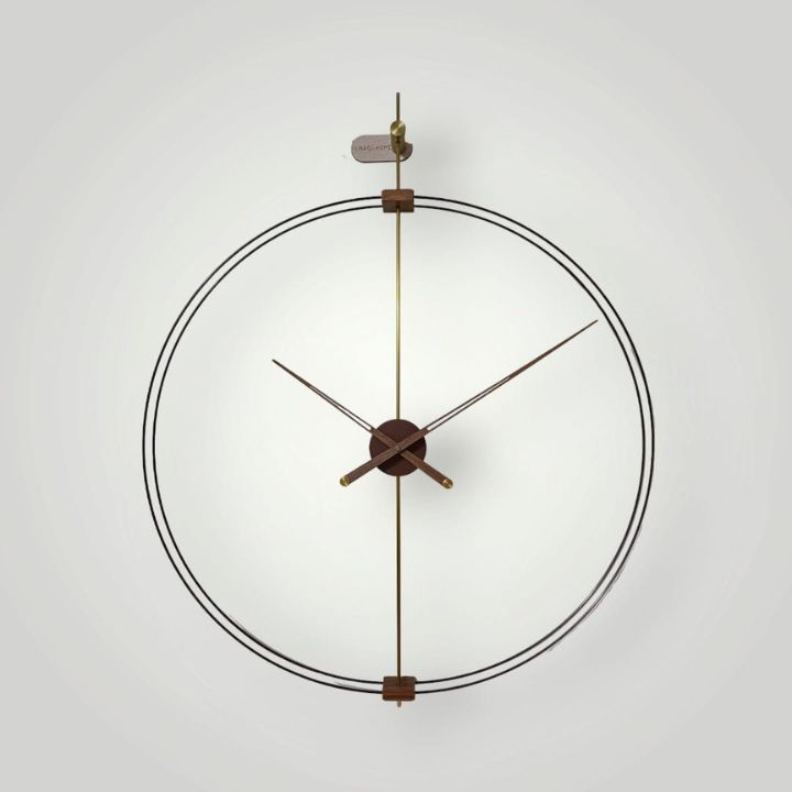 Super sleek double ring metallic and wooden wall clock by The Gharnish, 24 inches, with modern design and clear clock face.