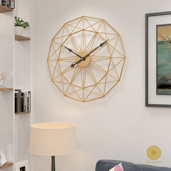 Metallic geometrical wall clock by The Gharnish, 30 inches, with a modern, abstract design, perfect for contemporary wall decor.