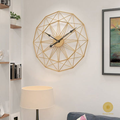 Metallic geometrical wall clock by The Gharnish, 30 inches, with a modern, abstract design, perfect for contemporary wall decor.