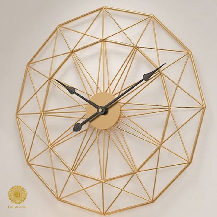 Large metallic geometrical wall clock by The Gharnish, 30 inches, with modern design and bold metallic finish.