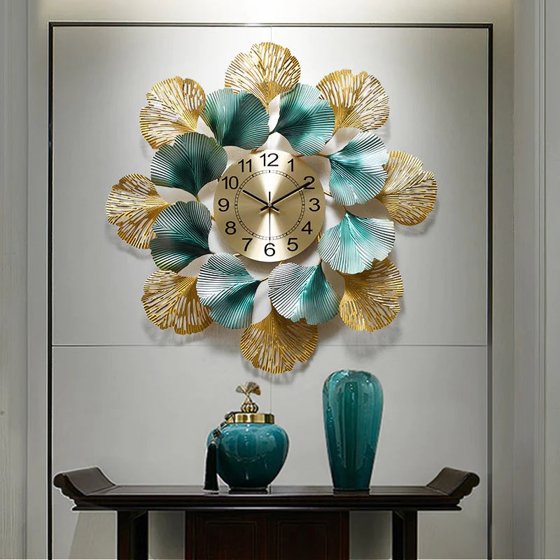 24-inch circular leaf metallic wall clock by The Gharnish featuring a stylish leaf design and modern metallic finish.