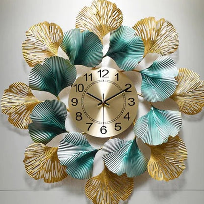 The Gharnish circular leaf metallic wall clock, 24 inches, with a modern leaf design and sleek metallic finish.