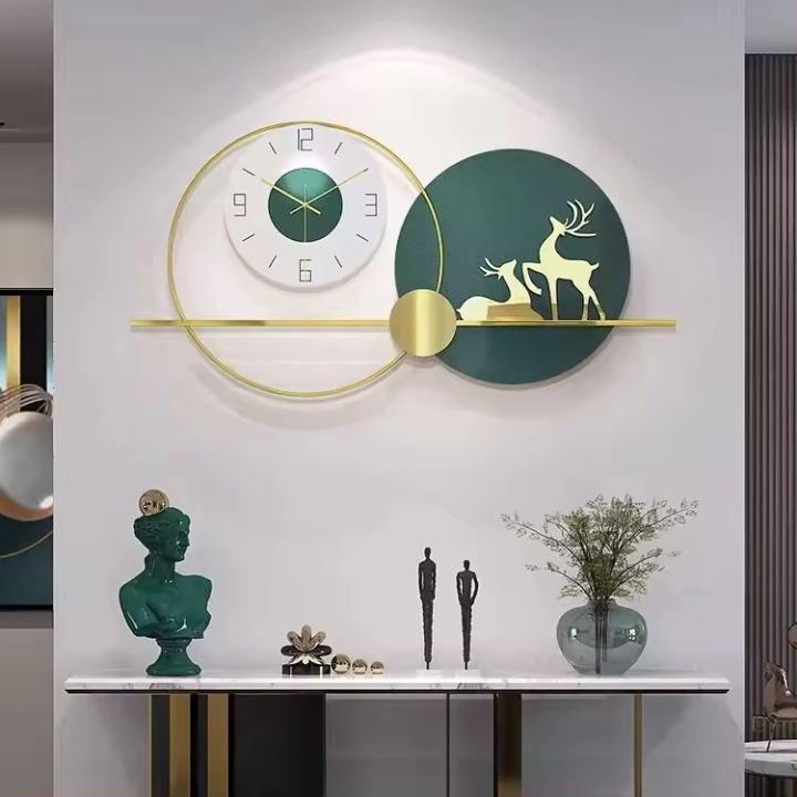Majestic wall clock by The Gharnish featuring a golden deer design and elegant round face, decorative wall timepiece.