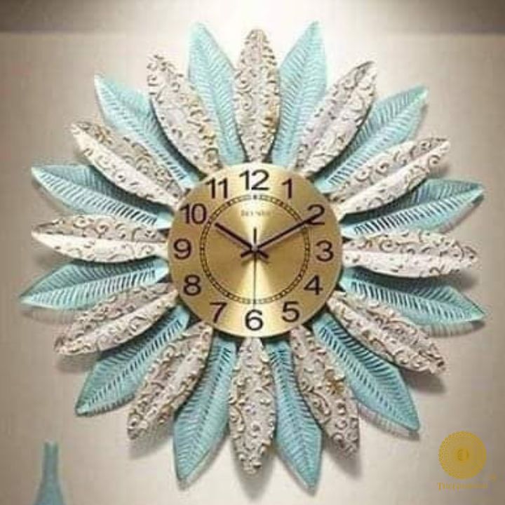 Metallic feather leaf wall clock by The Gharnish, 30-inch round design with a modern, decorative metallic finish.