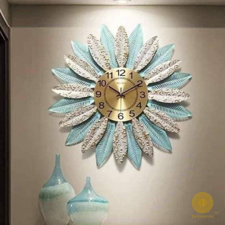 Metallic feather leaf wall clock by The Gharnish, 30-inch round decorative wall clock with intricate feather design.