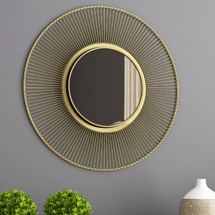 Metallic decorative wall mirror by The Gharnish, 24-inch round mirror with a modern metallic frame for stylish wall decor.